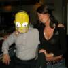 This is EMILY posing with R. B. who iswearing the HOMER SIMPSON mask that I got him as  joke for HALLOWEEN. 