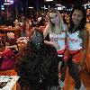Here he is with two of the 
Hooters girls.