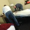 The room that we had at Comfort Suites had two double beds, and a pull out mattress.
This, and the next 4 pics are what is referred to as The Blind Leading The Blind. 
Drumstir and S. B. attempting to make the pull out bed.