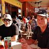 Once we were all together we
secured a table out on the beach deck. 
Here are Spike (L) and R. B. taking in the great weather
that we had.