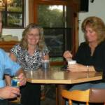 Here we have Garo, Sharon, and Vicky enjoying the evening together. Gary is their Boss! Where else could they sit? 