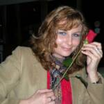Joebo bought Kveta a rose from the traveling flower child. 