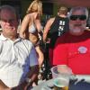 Here is a pic of R. B., and Spike out on the deck of 
Shephard's Tiki Bar.
They were Photo Bombed by
The girl in the bikini!
Go figure!