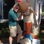 This is a little hard to explain.
First of all this is a statue of
a Hooters Dolphin. And there
is S. B. doing his thing!