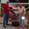 Here is KENNY J receiving the keys for the Cessna airplane that he purchased recently. That is not a UFO on the seller's pant leg. Flash from the camera. The original was taken with a cell phone camera