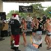Here is SANTA CLAUS 
again handing out some goodies to the cowgirls.. 
He changed his shirt to one 
of BUCK'S NAKED band. 
I think it was planned!