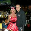 And this is one of our fave bartenders at Legends, 
TRICIA, in costume as
Mini Mouse posing with
one of the Managers.