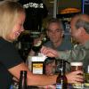 Here is TRICIA delivering 
a large draft beer with our Geezers Nite Out "Class Clown" R. B. 
taking it all in.