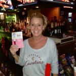 This is our fave bartender at Legends Sports Pub, Tricia. holding a card that the Geezers gave to her for a 
Christams tip. We had been there in the early part of December, but forgot to leave her something then.