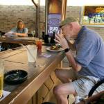 Here is Buddmann, our International Geezer from Germany enjoying the Happy
Hour wings. He was born, and raised in the States, but lives abroad. He also played in a band in the 60's in Kent with
JoeBo!  (Not playing a harmonica in this pic) 