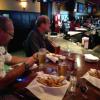 JIMBO FISH on the left
and R. B. enjoying their
fries and beer.