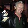 This is another one of our 
former Goodyear Associates
G2 (GARY SUTHERLAND).
We have two Geezers named Gary so one bartender called
Gary Sutherland G2.
That is not a Vulcan salute. He
had some surgery on his hand.