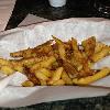 Johnny J's Has Free Fries when you sit at the bar. 
Called Bar Fries Not
Bar Flies!