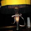 Here is that same lamp 
after KRISKO took the 
ribbon that was on the 
cookie wrapper when they were covered, and she tied it to
the Leg Lamp!