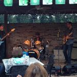 This is a pic of the band, DELTA DON, It is amazing that they even set up let alone played music. 
An hour earlier it was pouring down rain. However, it cleared up enough to ahve the patio party go off without a hitch.
Oh, they did ahve to light the 
patio heaters again.