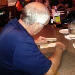 Here is DEWSTER, GAYLE'S
husband picking his numbers
for the Ohio lottery Keno game.