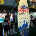 A  shot inside of Crabby's,
and their signature surf board.
We found Crabby's by accident last year. 
We were leaving Hooters in
Clearwater Beach, and some of us were separated from the others. Like Spike and I. We ventured back to Shephard's to watch the Super Bowl The rest walked the beach.
