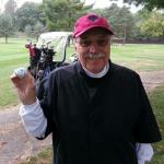 This, my friends, is what a person looks like after scoring
a Hole-In-One. 
Here is Dewster Hamilton holding the "famous" ball that found its way directly to the
cup from the tee. His next stop? Legends Sports Bar.