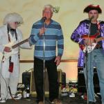 Here are Joe Buz, and Hank
with a friend of Hank's who
came up and sang a song with the band. He is Skip Scherer
who is a member of the Hitmen.  