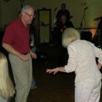 Here are S. B., bass player
in the Phantom Band, tripping
the light fantastic with Betty
Jacobs during the Legends Band performance.