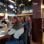 From L-R, R. B., Spike, and 
Robo (Spike's son Rob) sitting
at the bar at Hooley's giving
you an idea of how it looks.