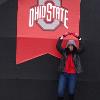 On our way into the stadium we walked passed these pillars that had an Ohio State
Flag on it. Mardi wanted me to take a pic of her doin' the "O"!