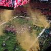 After the clock wound down to 00.00 Gold Confetti came 
shooting out of cannons from
the four corners of the end
zone.  
People asked why not scarlet and gray? Well the gold matches the Championship
Trophy color that OSU won.