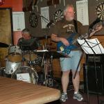 The BIG Boy tuning his bass guitar with BIG DADDY in the background tuning up his.....drums?