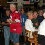 In the red OSU jersey is BIG DADDY smoozing with the crowd during a break in the action. In the background are GUINTER to the left, and in the Blue jersey from Oklahoma is lead guitarist HANK INMAN.