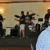 Another shot of the PHANTOM
BAND  in between songs.
(L-R) JOE BUZ, HANK, BIG DADDY (Drums) and S. B.
(Skinny Boy) DOUGIE.