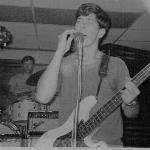 Jon E Hop playing harmonica 
and bass at the same time
with Ronnie in the background.