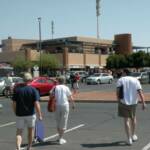 BUFFALO, LYNDA & WARREN WALKING FROM THE PARKING LOT TOWARDS THE BALLPARK IN PEORIA.