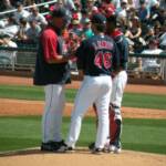 OH OH, PITCHING COACH CARL WILLIS ASKING THE PLAYERS WHERE THEY ARE GOING TO GO EAT DINNER. 