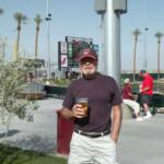 JIM BOB POSING IN FRONT OF THE SCOREBOARD AT GOODYEAR BALLPARK. HE MOOCHED THE BEER OFF OF ME THAT HE IS DRINKING!