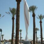 THIS IS A MODERN PIECE OF ARCHITECTURE RESEMBLING A DEFLATED BASEBALL AT THE ENTRANCE TO GOODYEAR BALLPARK. IT'S COST WAS AROUND $30,000, BUT THE CITY OF GOODYEAR PAID FOR IT, AS THEY DID EVERYTHING ELSE THAT YOU HAVE SEEN SO FAR. 